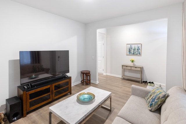 living room with wood finished floors and baseboards