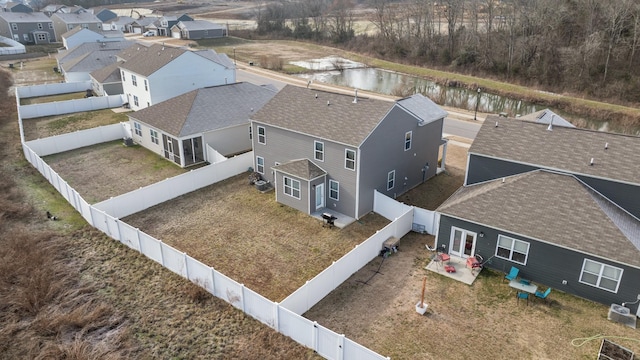 bird's eye view with a residential view and a water view