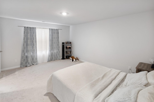 carpeted bedroom with baseboards