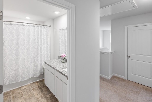 bathroom with vanity and baseboards