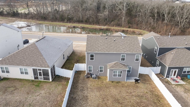 birds eye view of property featuring a water view