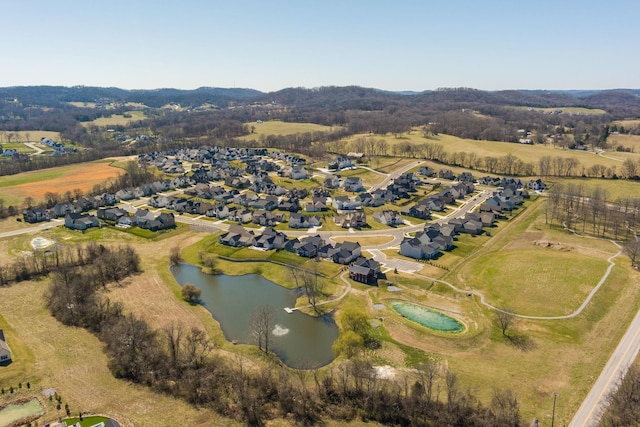 bird's eye view featuring a residential view and a water view