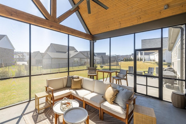 sunroom / solarium featuring a residential view, wood ceiling, and vaulted ceiling