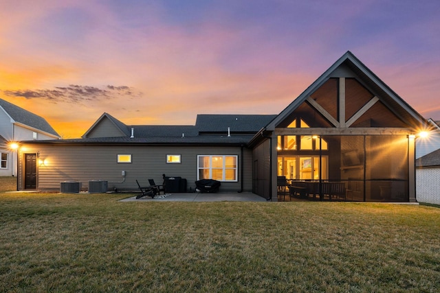 back of house featuring a patio, central AC, and a yard