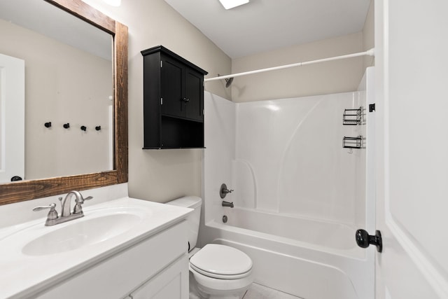 bathroom featuring toilet, vanity, and shower / tub combination