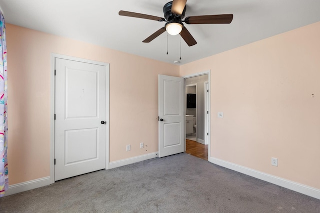 unfurnished bedroom with baseboards, carpet, and a ceiling fan