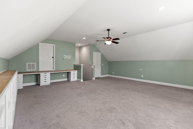 additional living space featuring visible vents, baseboards, carpet, and a ceiling fan