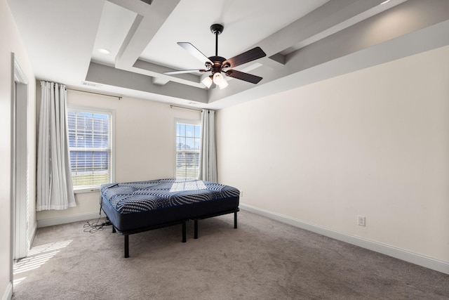 bedroom with visible vents, a raised ceiling, baseboards, and carpet floors