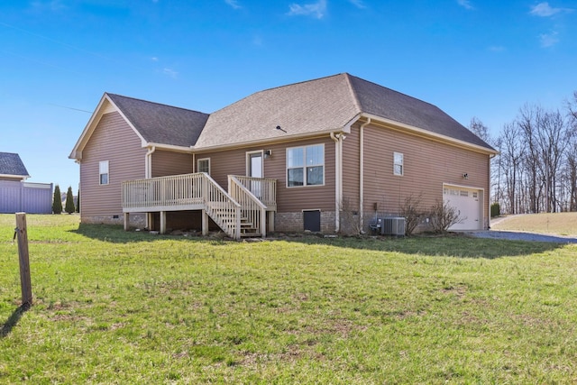 back of property featuring a lawn, cooling unit, a shingled roof, and a deck