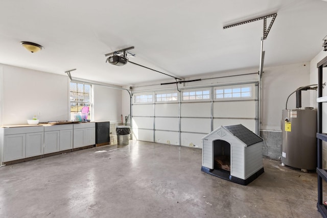 garage with a garage door opener and electric water heater