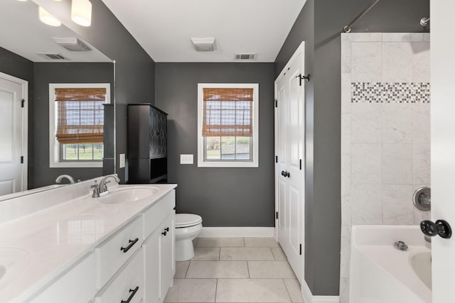 bathroom with baseboards, visible vents, a sink, toilet, and shower / bathtub combination