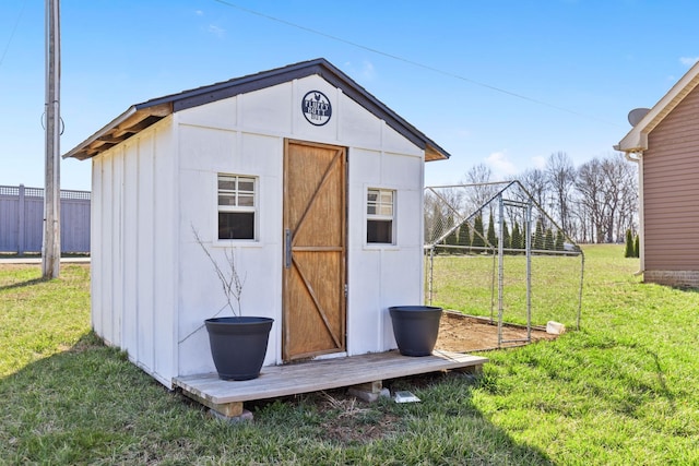 view of shed featuring fence