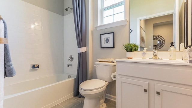 full bathroom featuring tile patterned floors, vanity, toilet, and shower / tub combo with curtain