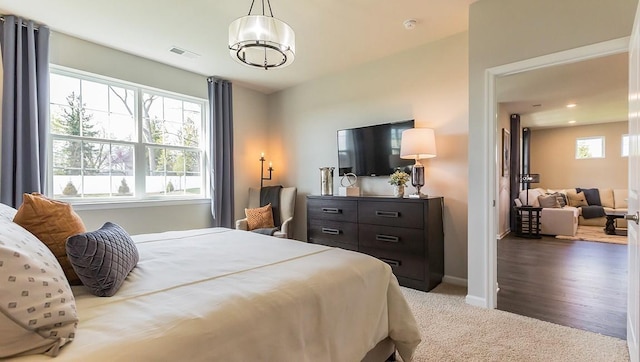 carpeted bedroom with visible vents, recessed lighting, and baseboards