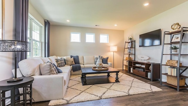 living area with visible vents, recessed lighting, baseboards, and dark wood-style flooring