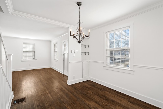 unfurnished dining area featuring dark wood-style floors, visible vents, baseboards, stairs, and crown molding