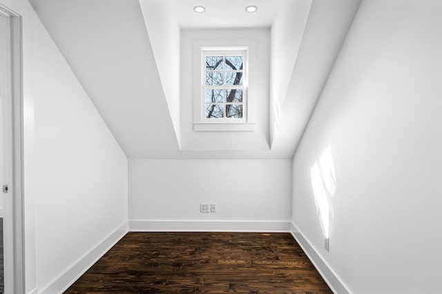 additional living space featuring dark wood-type flooring, recessed lighting, and baseboards