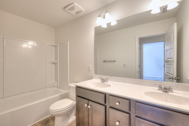 full bath with double vanity, visible vents, toilet, and a sink