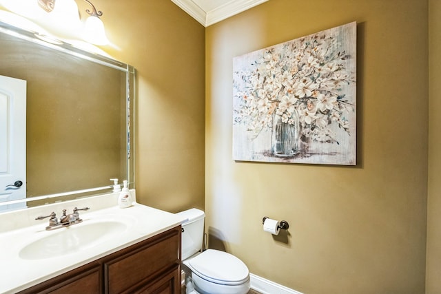 half bath with toilet, vanity, and crown molding