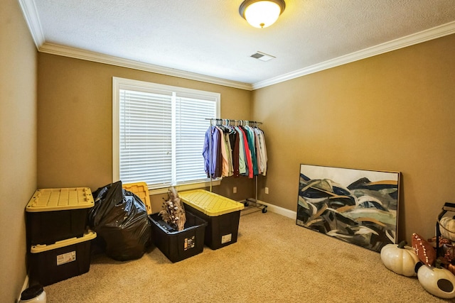 bedroom with a textured ceiling, baseboards, carpet floors, and ornamental molding