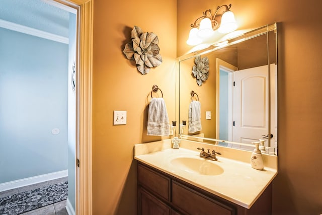 bathroom featuring baseboards, vanity, and tile patterned flooring