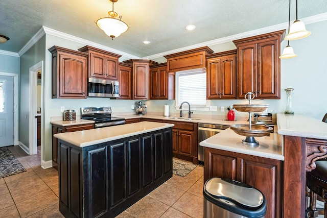 kitchen with ornamental molding, stainless steel appliances, light countertops, and a sink