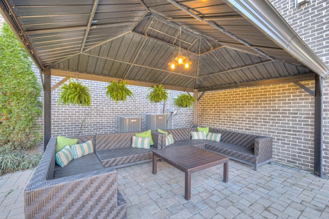 view of patio with a gazebo and outdoor lounge area