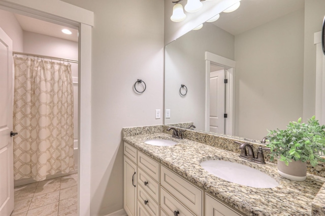 bathroom featuring a sink, shower / tub combo, double vanity, and tile patterned floors