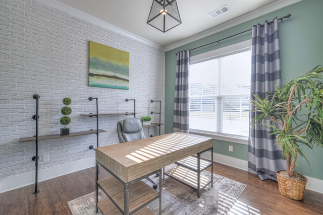 office space featuring crown molding, wood finished floors, visible vents, and brick wall