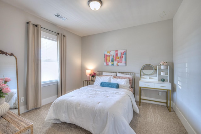 bedroom with carpet, baseboards, and visible vents