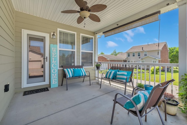 view of patio / terrace featuring a residential view and ceiling fan