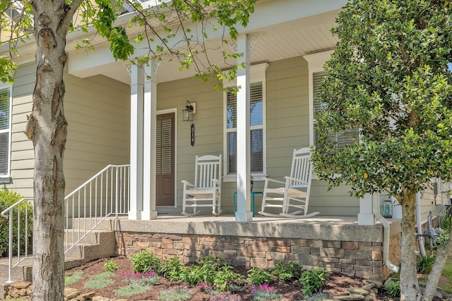 entrance to property featuring a porch