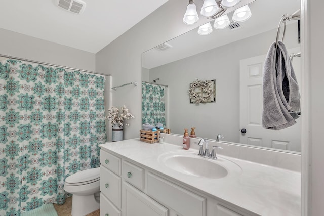 bathroom featuring vanity, toilet, a shower with curtain, and visible vents