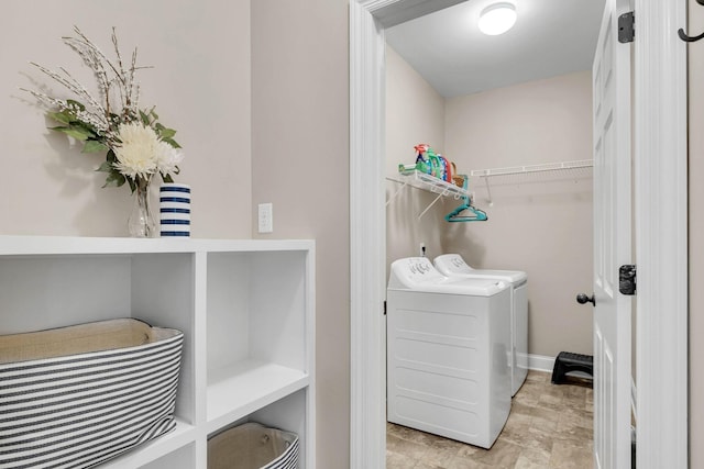 laundry area with laundry area and washer and clothes dryer