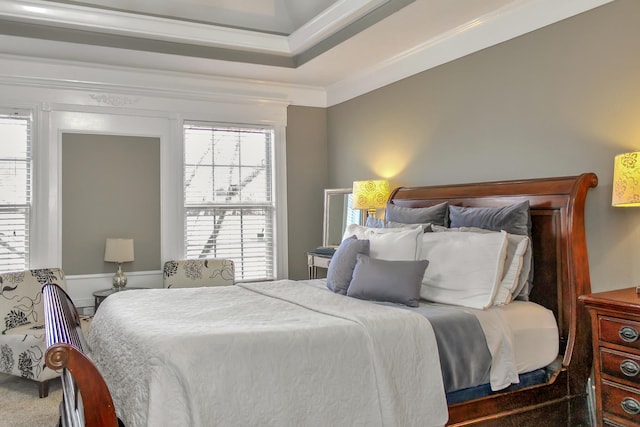 carpeted bedroom featuring ornamental molding