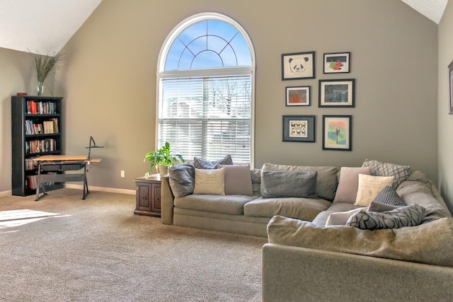 living area with lofted ceiling, baseboards, and carpet floors