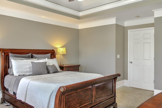 carpeted bedroom with a ceiling fan, baseboards, and ornamental molding