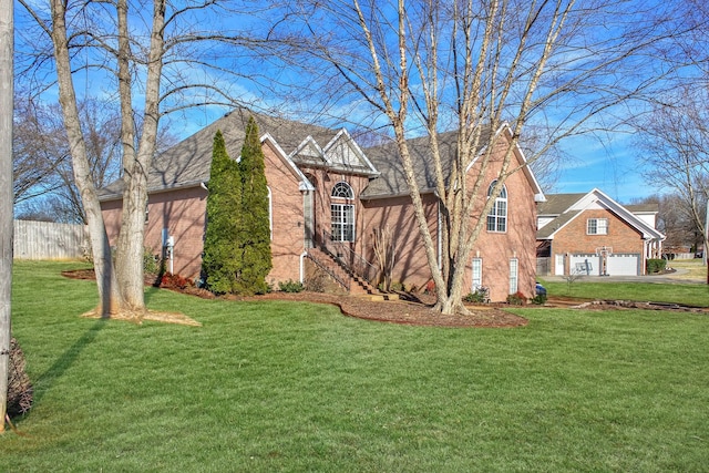 view of front facade with a front lawn, brick siding, a garage, and driveway