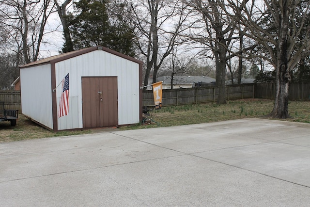 view of shed with fence