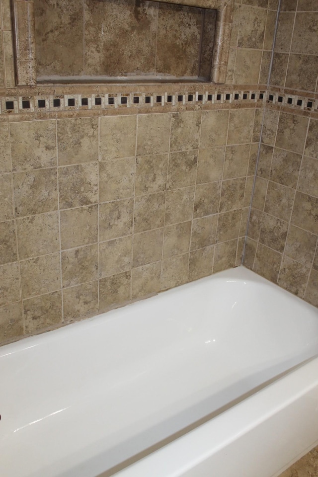 full bathroom with a tub to relax in