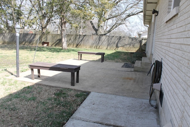 view of property's community featuring a yard and fence