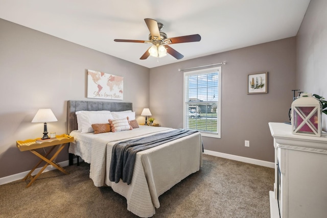 bedroom with ceiling fan, baseboards, and dark colored carpet