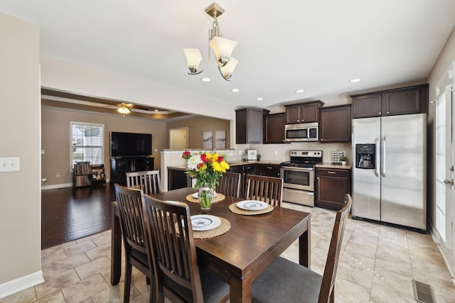 dining area with light tile patterned floors, recessed lighting, visible vents, and baseboards