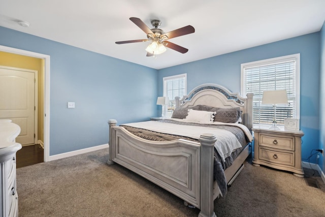 carpeted bedroom featuring baseboards and ceiling fan