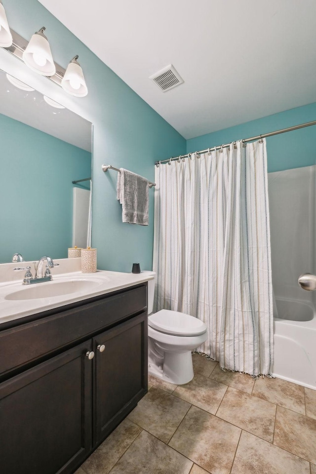 full bath with vanity, visible vents, shower / bath combo, tile patterned flooring, and toilet