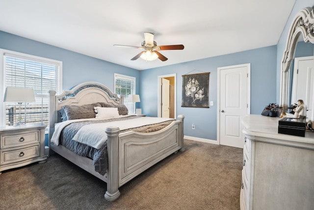 bedroom with dark colored carpet, baseboards, and a ceiling fan