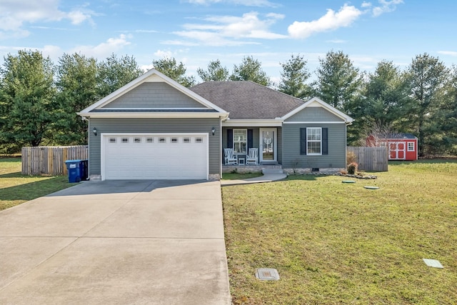 ranch-style house featuring driveway, a front yard, an attached garage, and fence