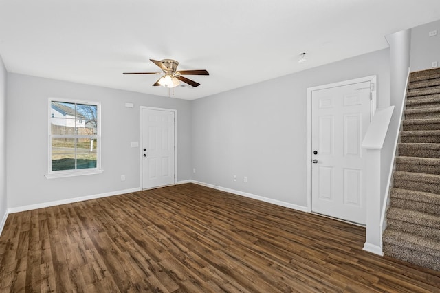 entryway featuring ceiling fan, stairway, baseboards, and dark wood-style floors