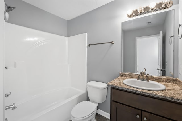 full bath with vanity, toilet, and washtub / shower combination