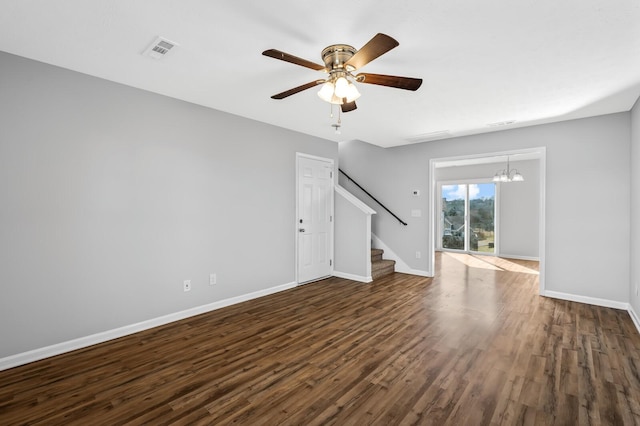 unfurnished living room featuring stairway, baseboards, visible vents, and dark wood-style flooring